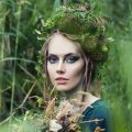 Forest portrait of fairy nymph woman in green grass outdoors